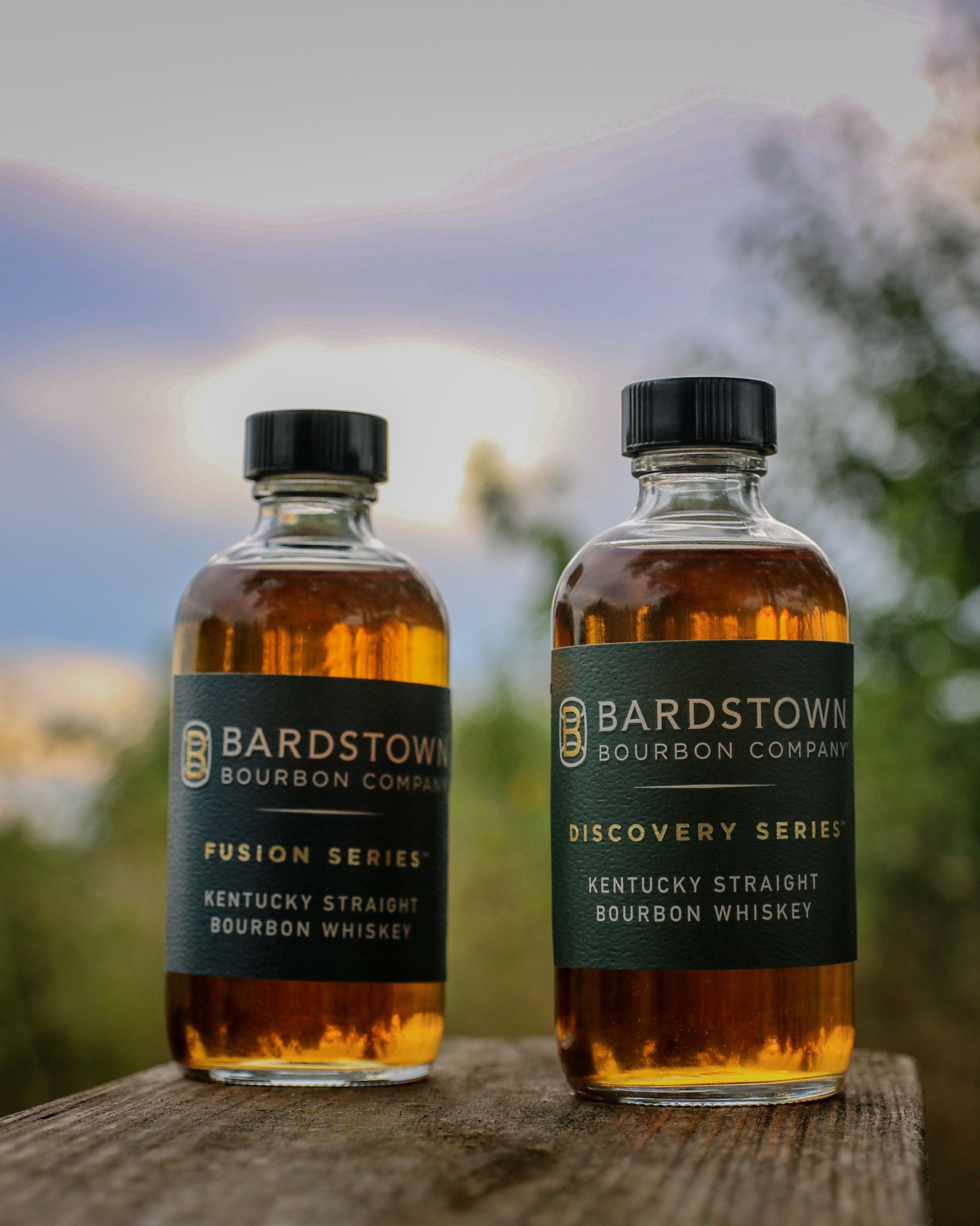 two bottles in the sunset.
