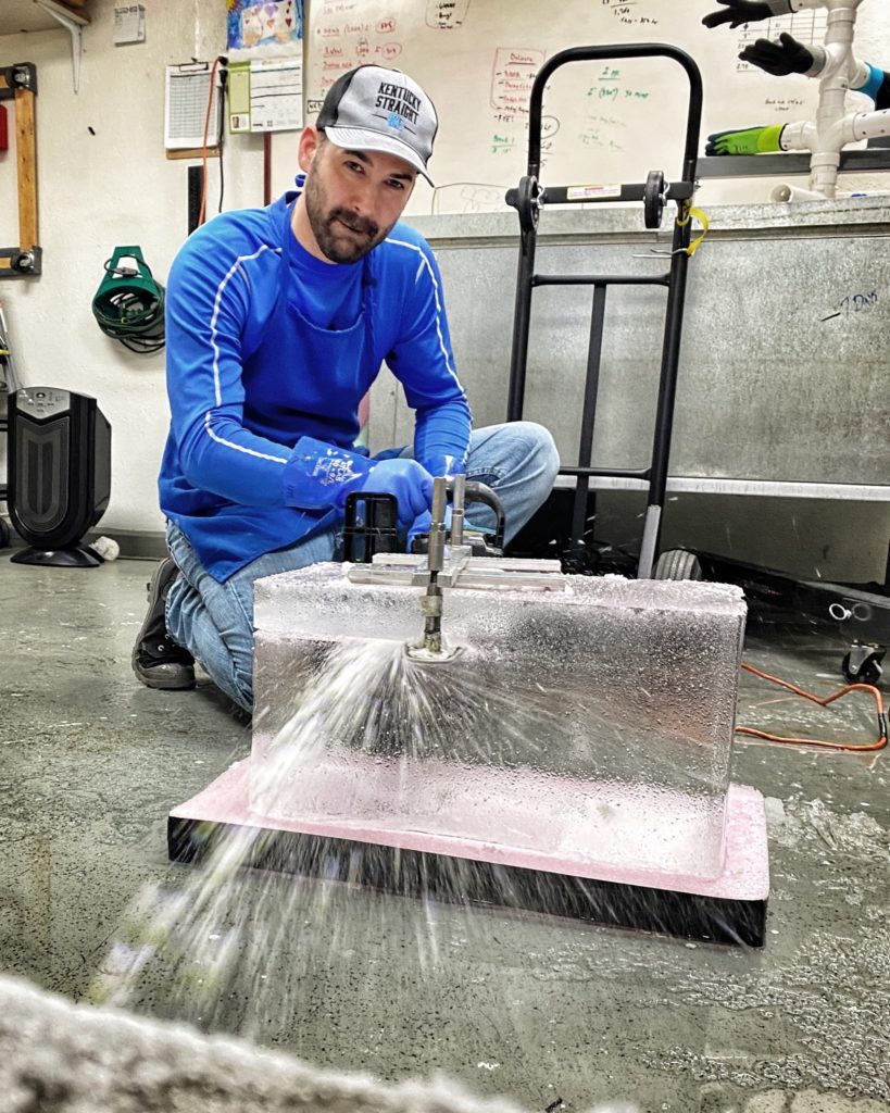 Man cutting ice