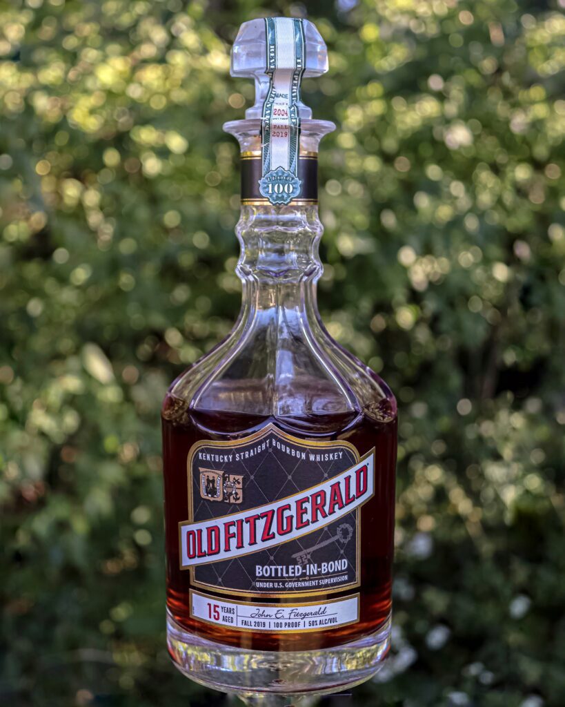 Old Fitzgerald 15 with an outdoor background.