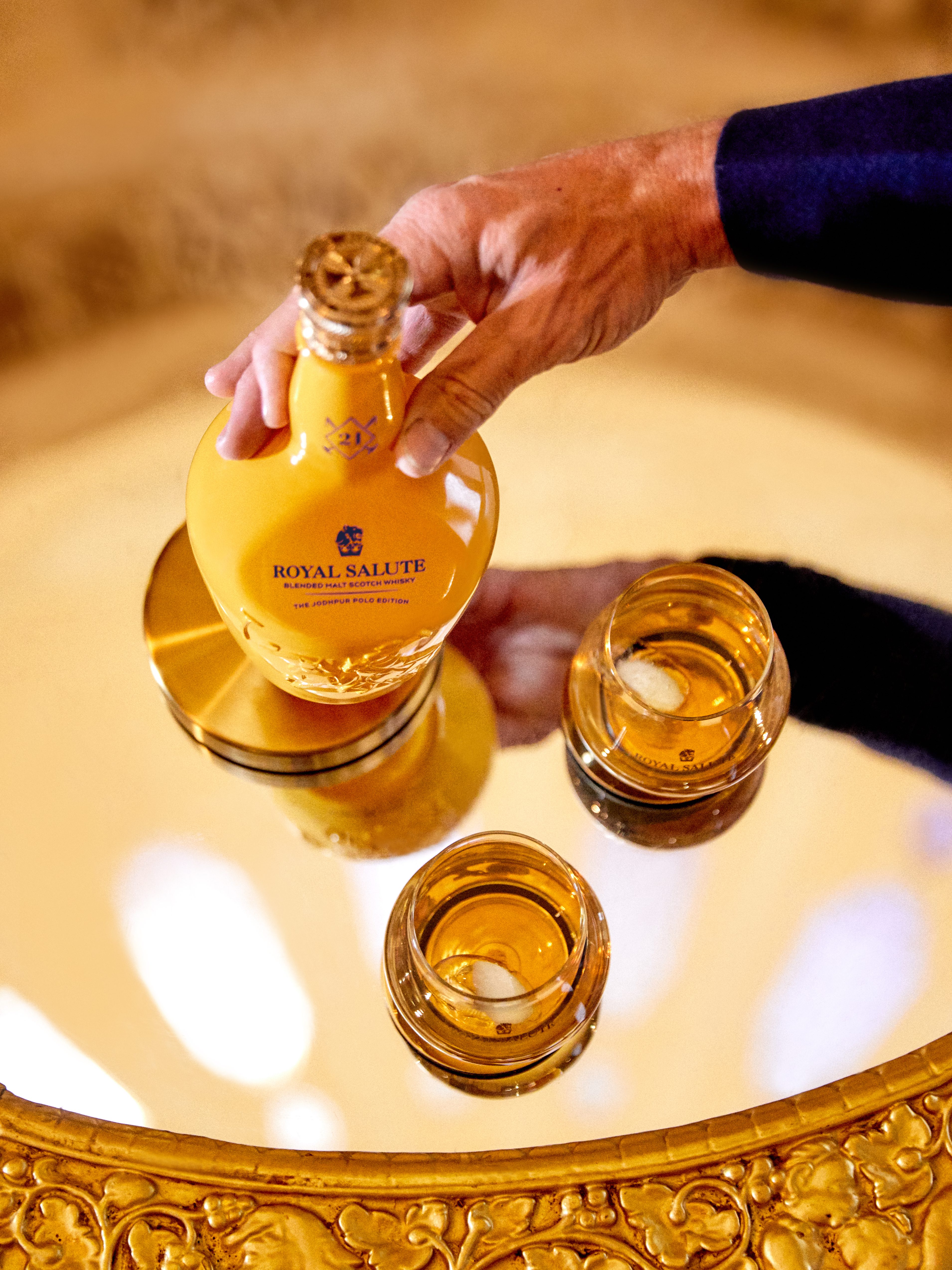 Royal Salute on a cart with two glasses.