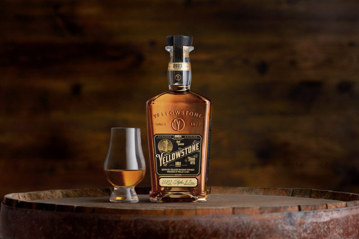 Bottle and glass on a barrel