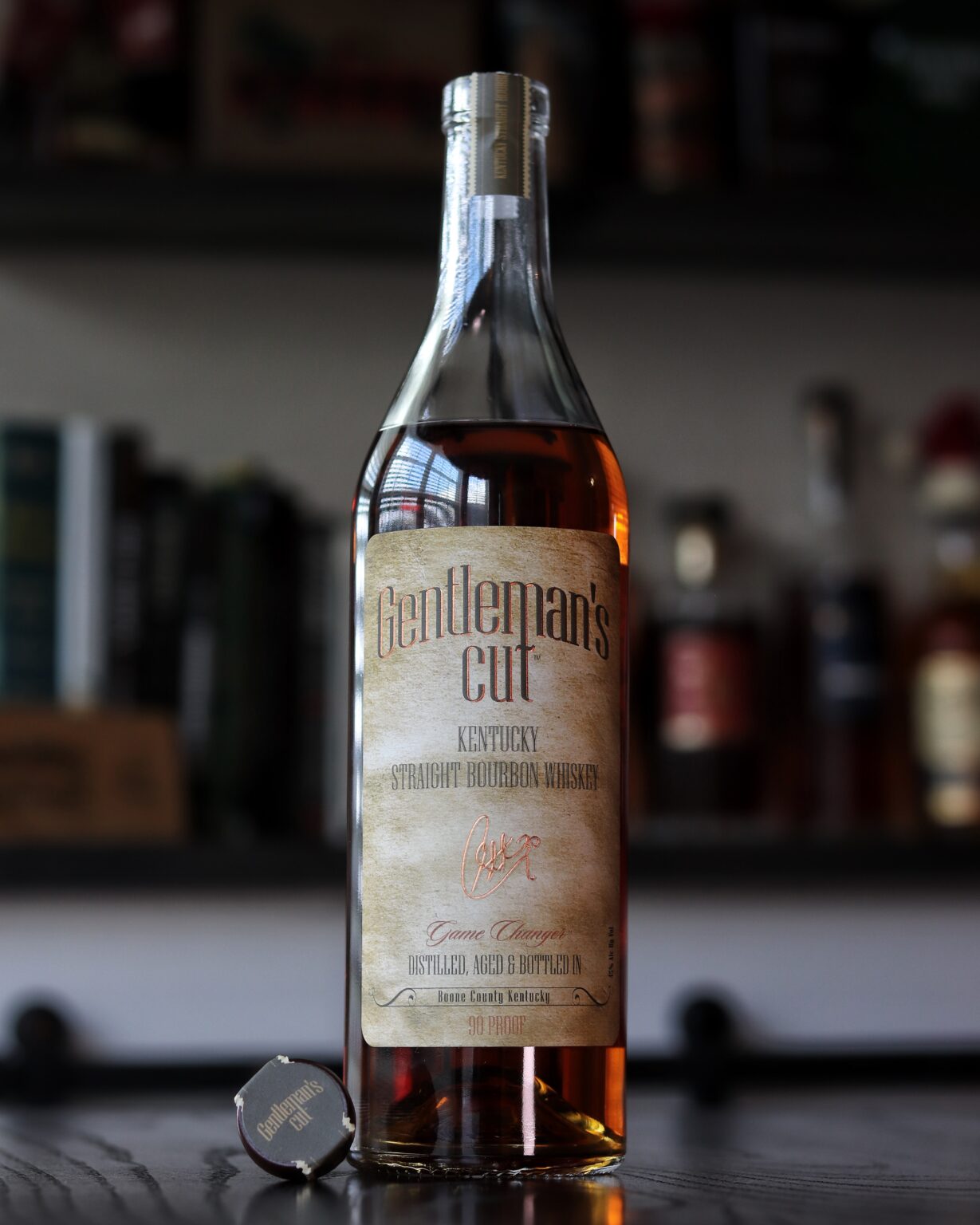 A bottle of whiskey on a tabletop.