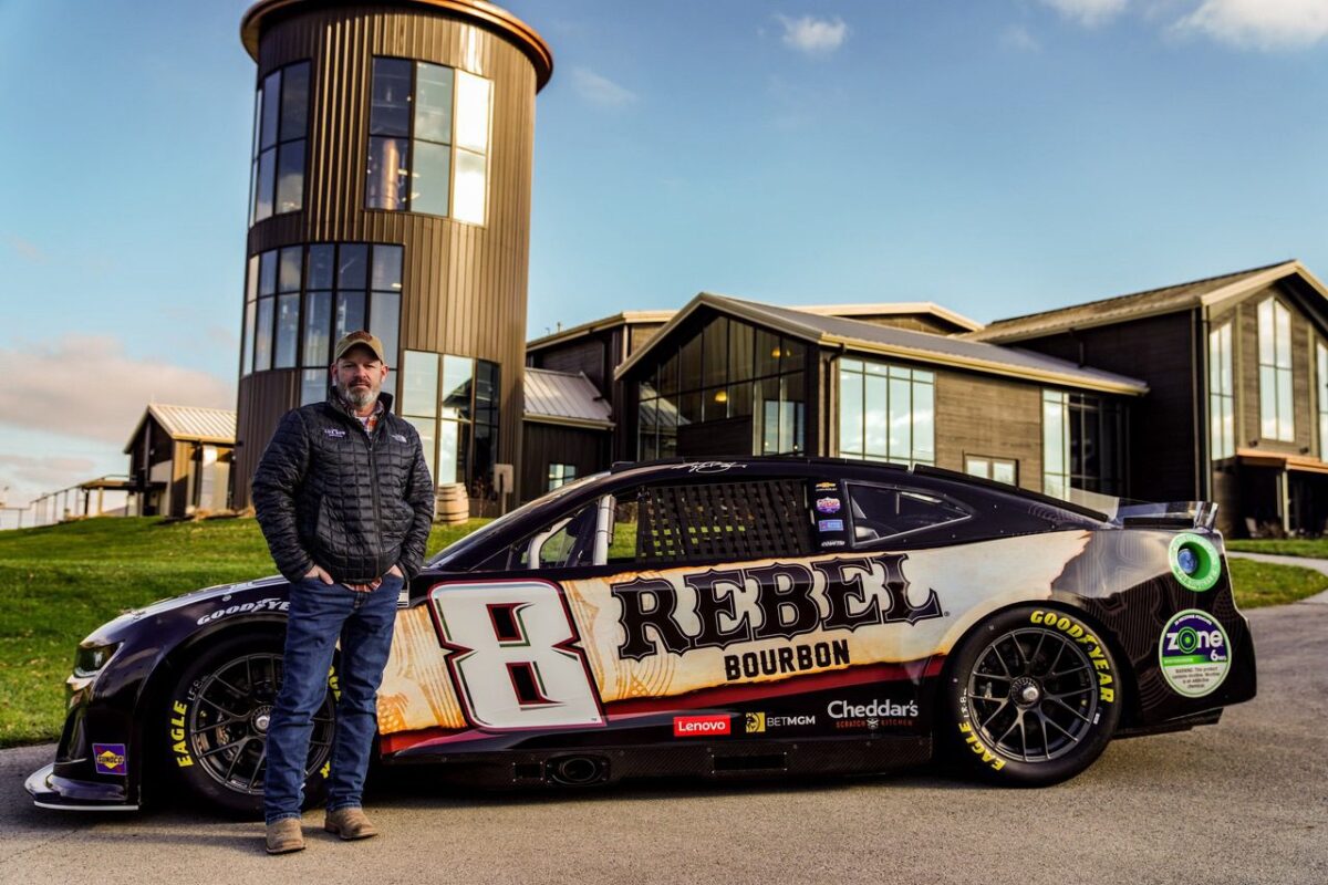 Jon Rempe in front of RCR #8 car