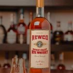 Rewco Rye on a bar with a glass.
