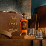 Whiskey JYPSi x Gibson displayed on table